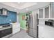 Modern kitchen with stainless steel appliances, sleek white cabinetry, and a clean, minimalist design at 12965 Ridge Rd, Largo, FL 33778