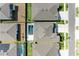 Aerial view of backyard swimming pool with a white deck, nestled between well-maintained homes and lush landscaping at 13071 Willow Grove Dr, Riverview, FL 33579