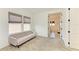 Bright bedroom with a comfortable couch, plush carpet, and natural light from two windows at 13071 Willow Grove Dr, Riverview, FL 33579