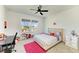 A bedroom with a desk, bed, and a view of the outside at 13071 Willow Grove Dr, Riverview, FL 33579