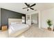 Spacious main bedroom features a modern accent wall, natural light, and neutral decor at 13071 Willow Grove Dr, Riverview, FL 33579