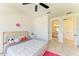 A bedroom with a bed and a view of the bathroom and hallway at 13071 Willow Grove Dr, Riverview, FL 33579