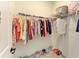 Walk-in closet with ample storage, wire shelving, and organized clothing and shoes for efficient space utilization at 13071 Willow Grove Dr, Riverview, FL 33579