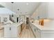Modern kitchen features an island with bar seating and pristine countertops with plenty of room to cook at 13071 Willow Grove Dr, Riverview, FL 33579