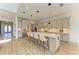 Bright, modern kitchen with large island, stainless steel appliances, and pendant lighting at 13071 Willow Grove Dr, Riverview, FL 33579