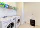 A laundry room with a washer, dryer, and storage space at 13071 Willow Grove Dr, Riverview, FL 33579