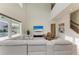 Bright living room with high ceilings, comfortable seating, and sliding glass doors to the pool area at 13071 Willow Grove Dr, Riverview, FL 33579