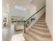 Bright open-concept living area with a staircase, large windows, and a comfortable sectional sofa at 13071 Willow Grove Dr, Riverview, FL 33579