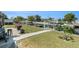 Waterfront backyard with dock, canal access, and outdoor seating area perfect for entertaining at 13401 Neptune Dr, Hudson, FL 34667