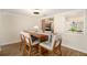 Charming dining area with modern lighting, perfect for Gathering gatherings and meals at 13401 Neptune Dr, Hudson, FL 34667