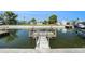 The private dock on the canal provides direct access to the open water at 13401 Neptune Dr, Hudson, FL 34667