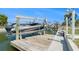 Boat dock with lift for easy access to the water at 13401 Neptune Dr, Hudson, FL 34667