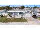 Charming single-story home featuring a well-maintained lawn and attached one-car garage at 13401 Neptune Dr, Hudson, FL 34667