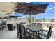 Entertain on this screened patio with dining table set overlooking the canal at 13401 Neptune Dr, Hudson, FL 34667