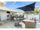 Relax on the screened patio with seating area and dining table set at 13401 Neptune Dr, Hudson, FL 34667