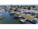 This waterfront property features a dock, a boat lift, and access to a scenic canal for boating and recreation at 13401 Neptune Dr, Hudson, FL 34667