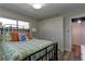 Cozy bedroom featuring a decorative bed frame and comfortable bedding at 1430 Normandy Park Oaks Dr # 9, Clearwater, FL 33756