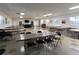 Spacious common room with tables, chairs, entertainment center, and large windows at 1430 Normandy Park Oaks Dr # 9, Clearwater, FL 33756