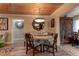 Dining area featuring a unique round table with elegant chairs and a charming wood ceiling at 1430 Normandy Park Oaks Dr # 9, Clearwater, FL 33756