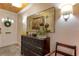 Foyer featuring an ornate dresser, elegant mirror, and decorative lamps at 1430 Normandy Park Oaks Dr # 9, Clearwater, FL 33756
