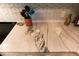 Close-up of marble countertops with chevron backsplash and kitchen utensils at 1430 Normandy Park Oaks Dr # 9, Clearwater, FL 33756