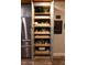 Pantry with pull-out drawers for easy access and organization of kitchen supplies at 1430 Normandy Park Oaks Dr # 9, Clearwater, FL 33756