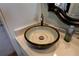 The bathroom boasts a stylish vessel sink with a beautiful, glazed finish and unique design at 1430 Normandy Park Oaks Dr # 9, Clearwater, FL 33756
