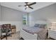 Cozy bedroom featuring ceiling fan, carpet floors, lots of natural light and modern decor at 14727 Tudor Chase Dr, Tampa, FL 33626