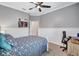 Cozy bedroom featuring ceiling fan, carpet floors, lots of natural light and space to work from home at 14727 Tudor Chase Dr, Tampa, FL 33626