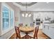 Dining room featuring a round table, wood chairs, and bright windows at 14727 Tudor Chase Dr, Tampa, FL 33626