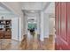 Grand foyer with hardwood floors, high ceilings, and an open view of the living area at 14727 Tudor Chase Dr, Tampa, FL 33626