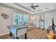 Spacious game room with a foosball table, pull up bar, couch and a large window at 14727 Tudor Chase Dr, Tampa, FL 33626