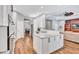 Spacious kitchen island with granite countertops, white cabinetry, and an open view to the living area at 14727 Tudor Chase Dr, Tampa, FL 33626