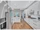 Bright kitchen with white cabinetry, stainless steel appliances and granite counters at 14727 Tudor Chase Dr, Tampa, FL 33626