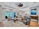 Open-concept living room with view of lanai and the gourmet kitchen at 14727 Tudor Chase Dr, Tampa, FL 33626