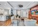 Spacious living room with tray ceilings, stylish furniture, and access to the outdoor area at 14727 Tudor Chase Dr, Tampa, FL 33626