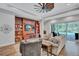 Comfortable living room with wooden built-ins and view of the lanai at 14727 Tudor Chase Dr, Tampa, FL 33626