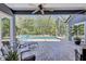 Covered pool area featuring brick flooring, a plunge pool, a jacuzzi, and lounge chairs at 14727 Tudor Chase Dr, Tampa, FL 33626