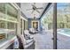 Covered patio with outdoor seating overlooking a pool and backyard at 14727 Tudor Chase Dr, Tampa, FL 33626