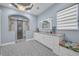 Modern bathroom boasts an oversized glass shower and double vanity with stone counters and decorative tile flooring at 16139 Coquina Bay Ln, Wimauma, FL 33598