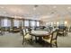 Spacious game room with poker tables, comfortable seating, and ample lighting for leisure and entertainment at 16139 Coquina Bay Ln, Wimauma, FL 33598