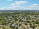 Breathtaking aerial view of a serene community with lush greenery, picturesque lakes, and well-maintained homes, offering tranquility at 16910 Equestrian Trl, Odessa, FL 33556