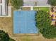 Aerial view of a well-maintained basketball court with blue surface and clearly marked lines at 16910 Equestrian Trl, Odessa, FL 33556