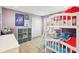 This bedroom has a bunk bed, a closet, and a dresser with purple decor at 16910 Equestrian Trl, Odessa, FL 33556