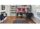 This bedroom has a loft bed with a study area and a chair below at 16910 Equestrian Trl, Odessa, FL 33556