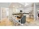 This stylish kitchen features an island with bar seating and stainless steel appliances at 16910 Equestrian Trl, Odessa, FL 33556