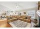 Open-concept living area with hardwood floors flowing into a connected kitchen at 16910 Equestrian Trl, Odessa, FL 33556