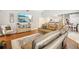 Comfortable living room featuring hardwood floors and an open layout to the kitchen at 16910 Equestrian Trl, Odessa, FL 33556
