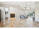 Bright living room with stone floors, high ceilings, and an open floor plan at 16910 Equestrian Trl, Odessa, FL 33556