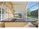 Summer Kitchen boasts a built-in grill and expansive countertop perfect for prepping delicious meals and outdoor gatherings at 16910 Equestrian Trl, Odessa, FL 33556